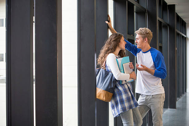 istock Young couple in school corridor 464572319