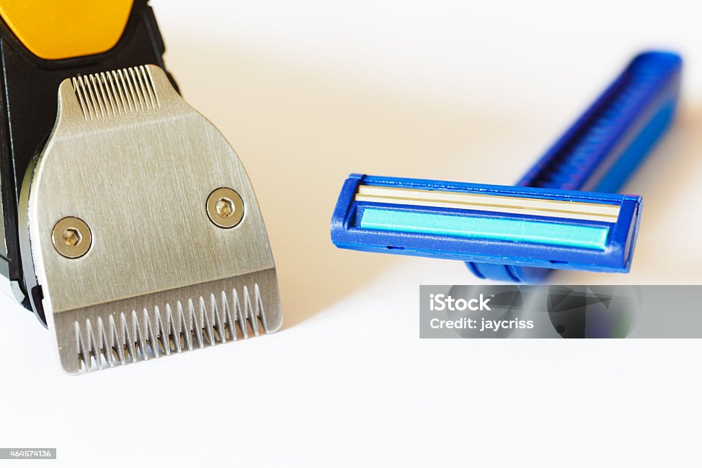 Beard trimmer against razor Macro shot of beard trimmer against razor 2015 Stock Photo