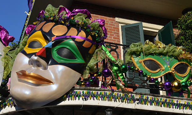 Giant masks as Mardi Gras balcony decorations in New Orleans View of a balcony in New Orleans, Louisiana, USA, decorated for carnival celebration of Mardi Gras. new orleans mardi gras stock pictures, royalty-free photos & images