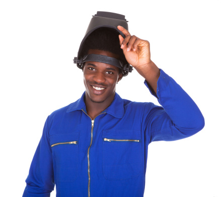 Portrait Of Happy Male Welder Standing Over White Background