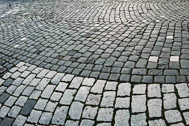 istock Cobblestone sidewalk made of cubic stones 464574569