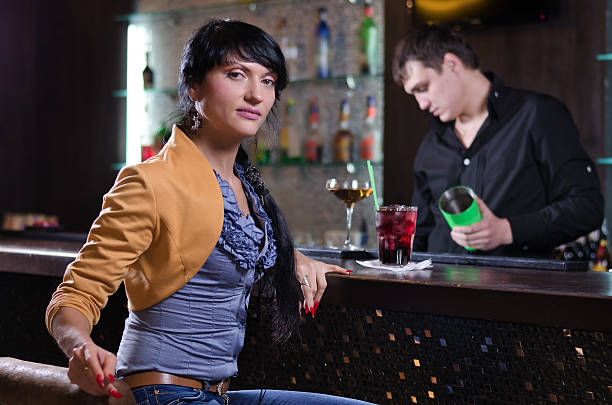istock Independent young woman relaxing alone at the bar 464574675