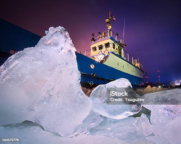 An Iceberg With A Ship Trying To Go Through Stock Photo - Download Image Now - Antarctica, Arctic, Polar Climate