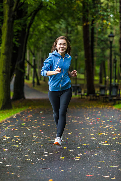 istock Young woman running outdoor 464576248