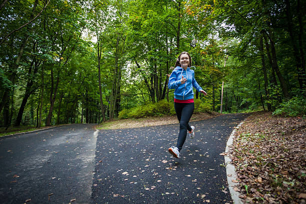 istock Young woman running outdoor 464576252
