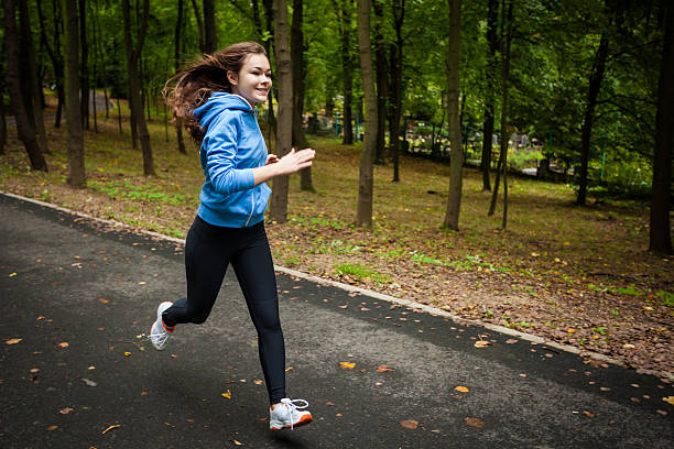 istock Young woman running outdoor 464576256