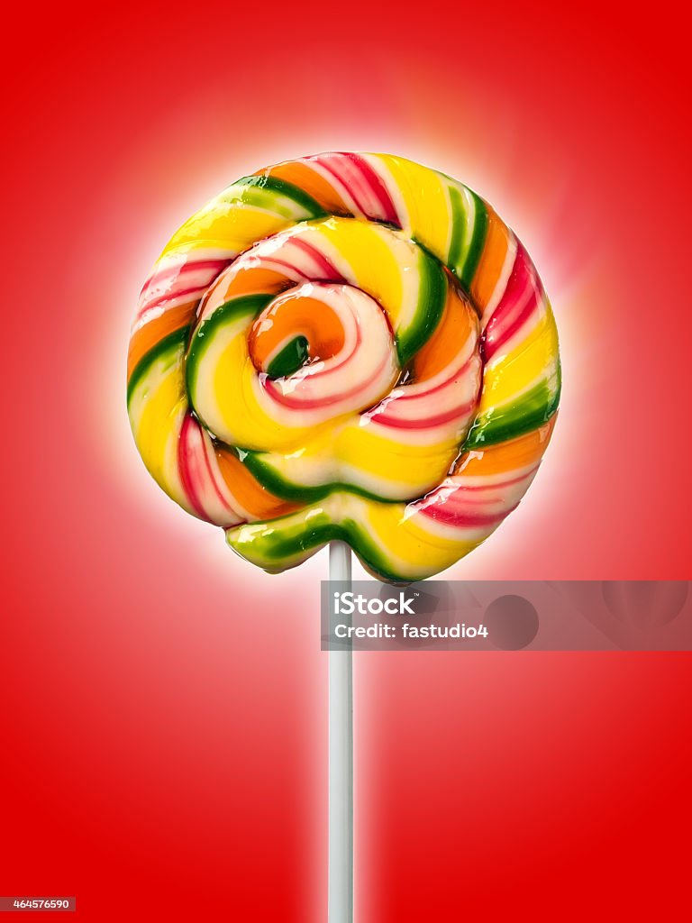 candy on a stick on red candy on a stick on red background 2015 Stock Photo