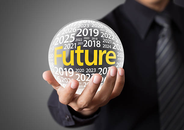 Businessman holding a glass ball