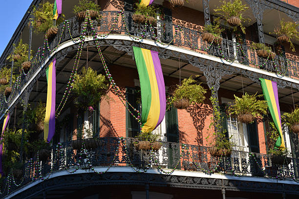 Mardi Gras in New Orleans, USA View of a typical house in New Orleans with Mardi Gras, carnival decoration. new orleans mardi gras stock pictures, royalty-free photos & images