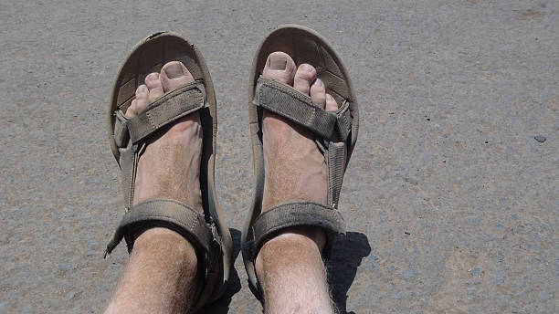 istock Dusty feet in sandal after long hike 464582362