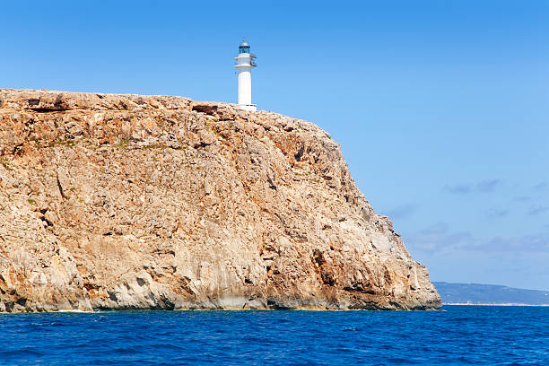 istock Formentera Barbaria cape Lighthouse view from sea 464589432