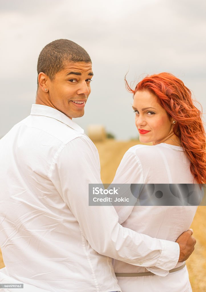 Couple in the field. Smiling couple in the field. 2015 Stock Photo