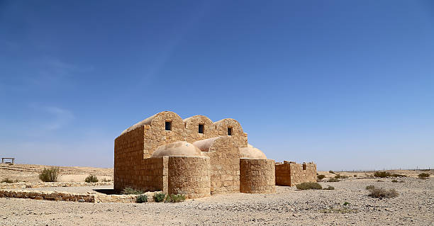 istock Quseir (Qasr) Amra desert castle near Amman, Jordan. 464593750