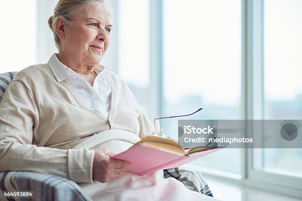 Reading And Dreaming Stock Photo - Download Image Now - 2015, 70-79 Years, Adult