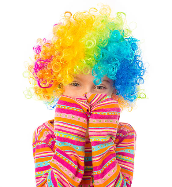 istock little girl in clown wig 464595593