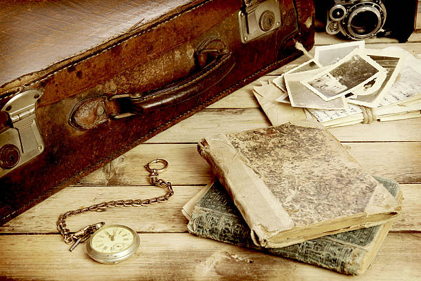 istock old suitcase, books, photos in retro style 464597132