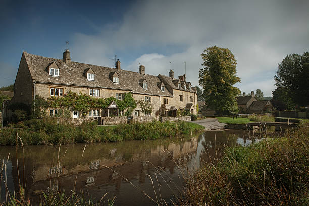 istock Stone houses in Lower Slaughter, Cotswolds, England 464597443
