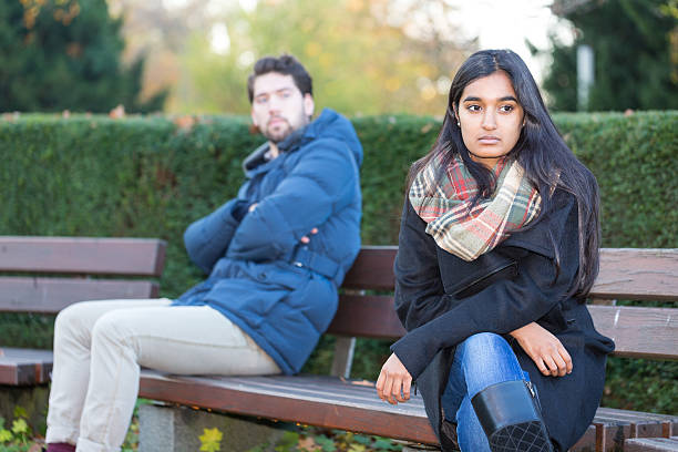 istock Couple sitting in bench after a fight 464597588