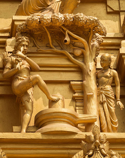 Kannappa Nayanar in Bangalore. Statue on the golden temple tower of Sri Naheshwara in Bengaluru depicts Kannappa Nayanar, the hunter that donates his eyes to honor Lord Shiva. lingam yoni stock pictures, royalty-free photos & images