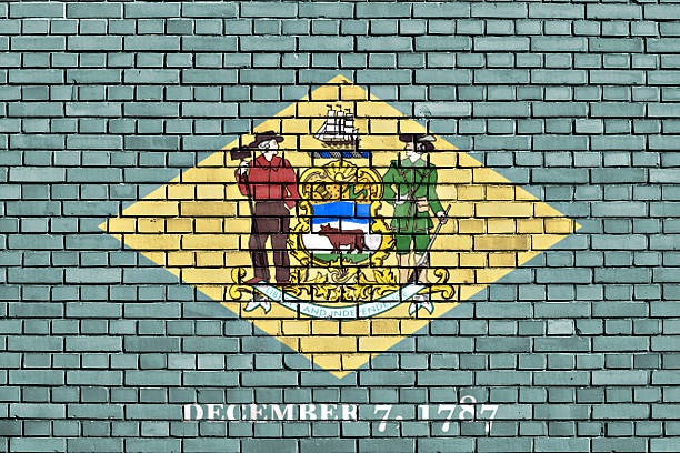 flag of Delaware painted on brick wall flag of Delaware painted on brick wall delaware us state photos stock pictures, royalty-free photos & images