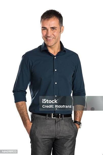Happy Smiling Middle Age Businessman With Hands In Pockets Stock Photo - Download Image Now