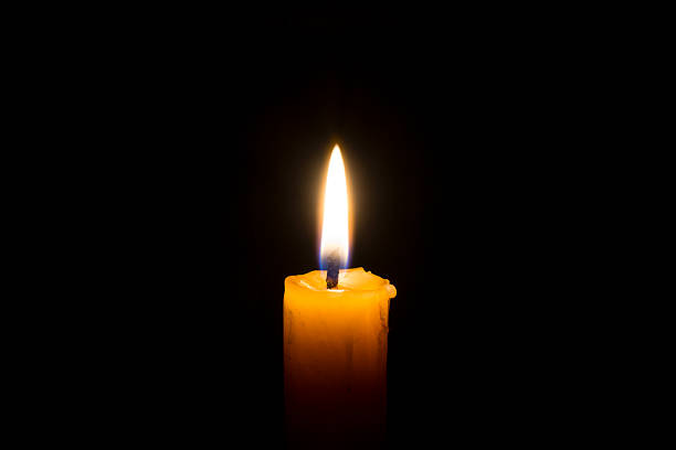 istock Yellow candle in the dark 464601336