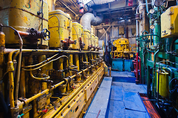 istock Engine room on a cargo boat ship with gears 464605444