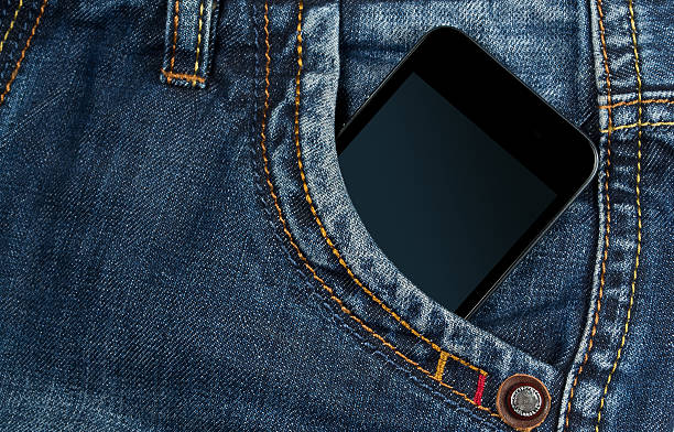 istock graded-screen smartphone in pocket blue jeans 464608556