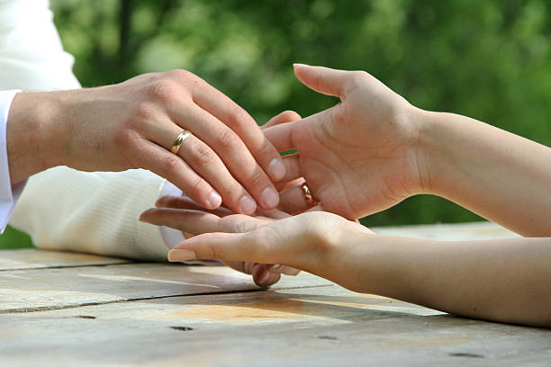 istock Bride and groom holding hands 464611878