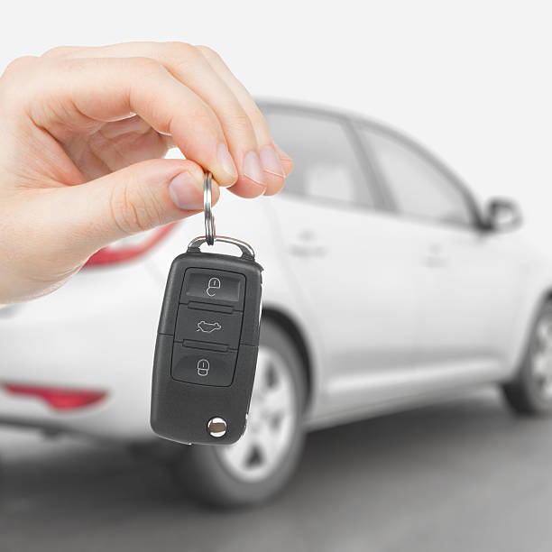 istock Male holding car keys with remote control system 464613342