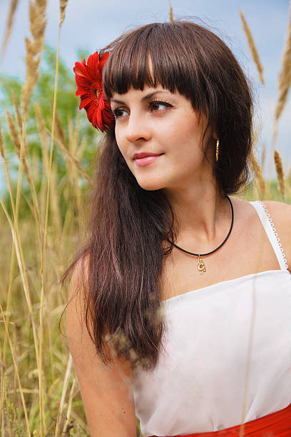 istock Pretty brunette in a field 464617499