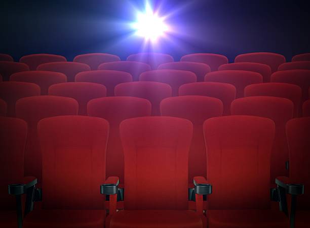 istock Cinema Red Seats with Projector Lights 464617551