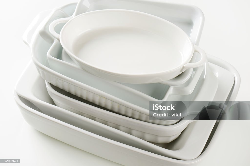 Variety of baking dishes Stacked baking dishes of various sizes and shapes Bakeware Stock Photo