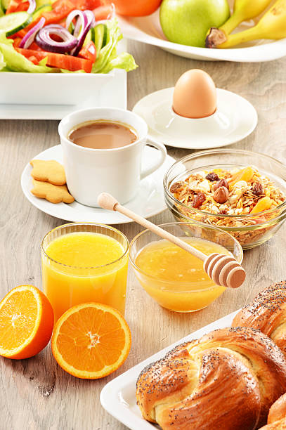istock Breakfast including coffee, bread, honey, orange juice, muesli a 464617961