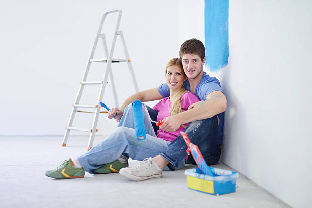 istock happy young cople relaxing after painting in new home 464621221