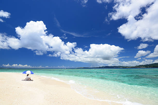 The woman who relaxes on the beach.