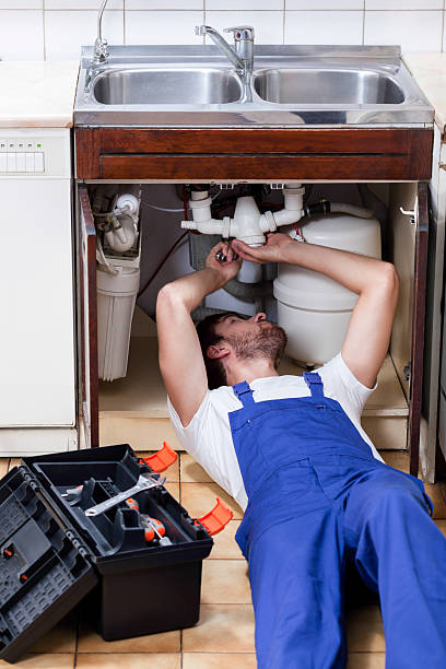 istock Plumber during repairing sink 464622934