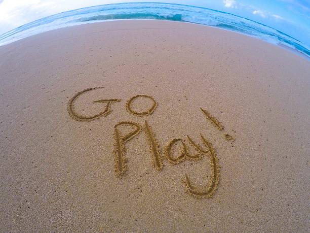 Go Play Sand Writing stock photo