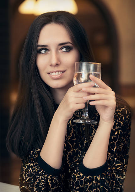 istock Beautiful Elegant  Woman Holding a Drink 464623260