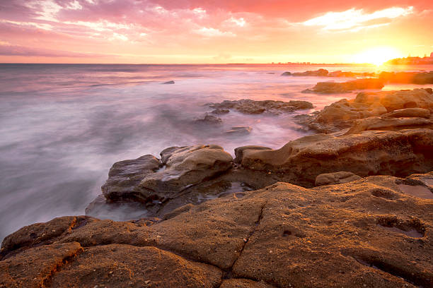 istock Rocks and waves at Kings Beach, QLD. 464627106