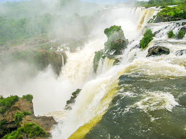 istock Iguassu waterfall in south america tropical jungle 464627502