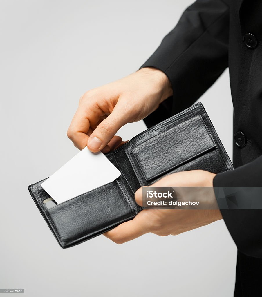 close up of man holding wallet with credit card man in suit with wallet and credit card. Wallet Stock Photo