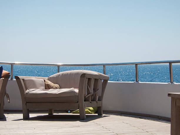 istock Sofa on a ship balcony with the red sea background 464628056