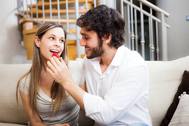 Couple eating strawberries