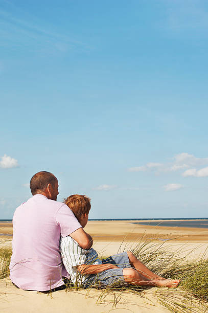 istock Father And Son Enjoying Beach View 464628623