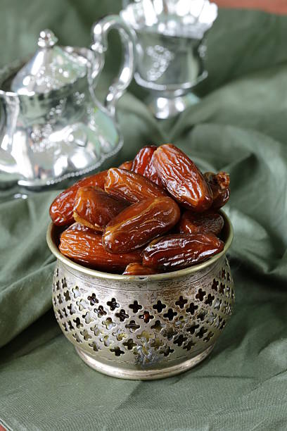 istock sweet dates (dry fruits) in metal bowl 464628739
