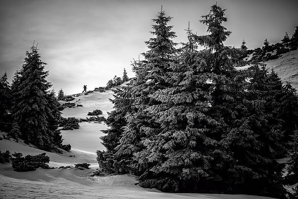 istock Climbing climber on snowy mountain 464629595