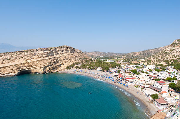 istock Panoramic view of Matala sandy beach with caves. Crete, Greece 464632350