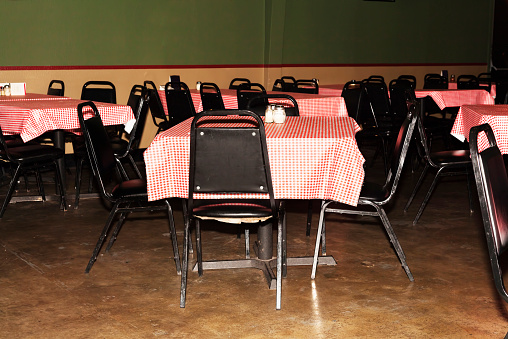 Empty Tables and Chairs At Inexpensive Restaurant