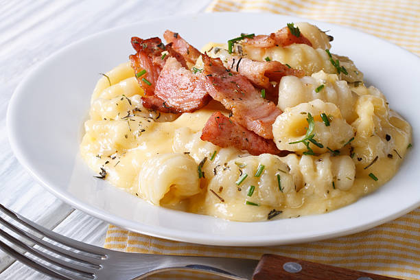 gnocchi with cheese sauce and bacon. close up. horizontal